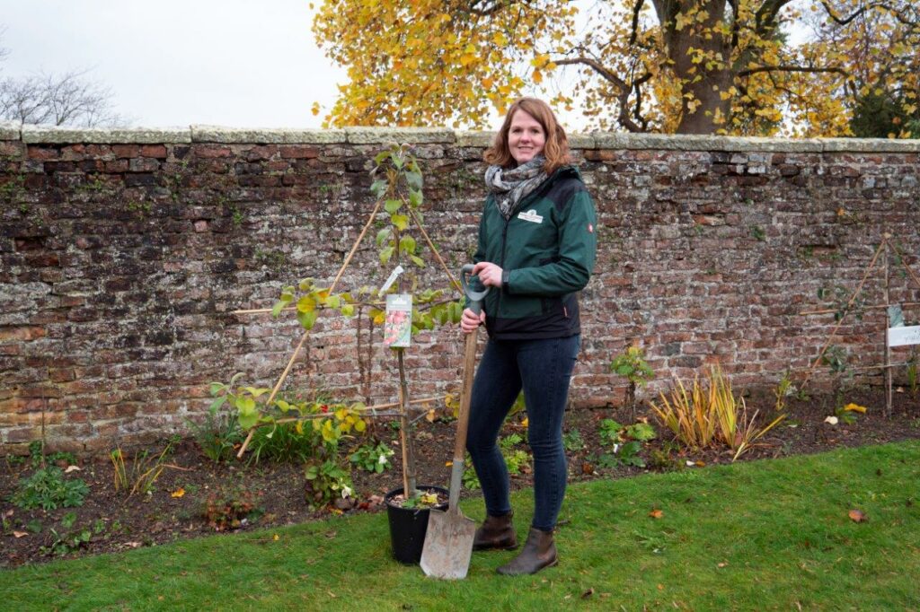 Steph James plants trees at Moreton Hall